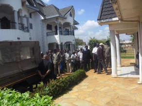 Police, family and friends at the deceased business persons home when the police retrieved the body.