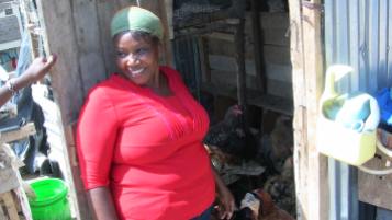 Mrs. Wainaina at her chicken perch.