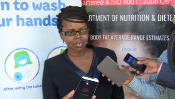 Wairimu Muriuki a Thika resident and the organizer of the hand washing event while addressing the press.