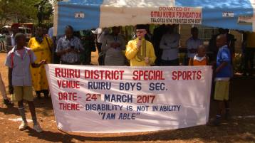 Nominated MP Isaac Mwaura addressing the residents and special pupils in Ruiru.