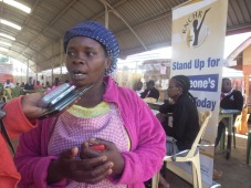 A beneficiary of Huduma Mashinani exercise held in Kamwangi market, Gatundu North talks to press.