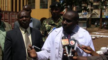 Thika Lands Chief Registrar Bernard Leitich addressing the press outside the Lands office in Thika sub-county.